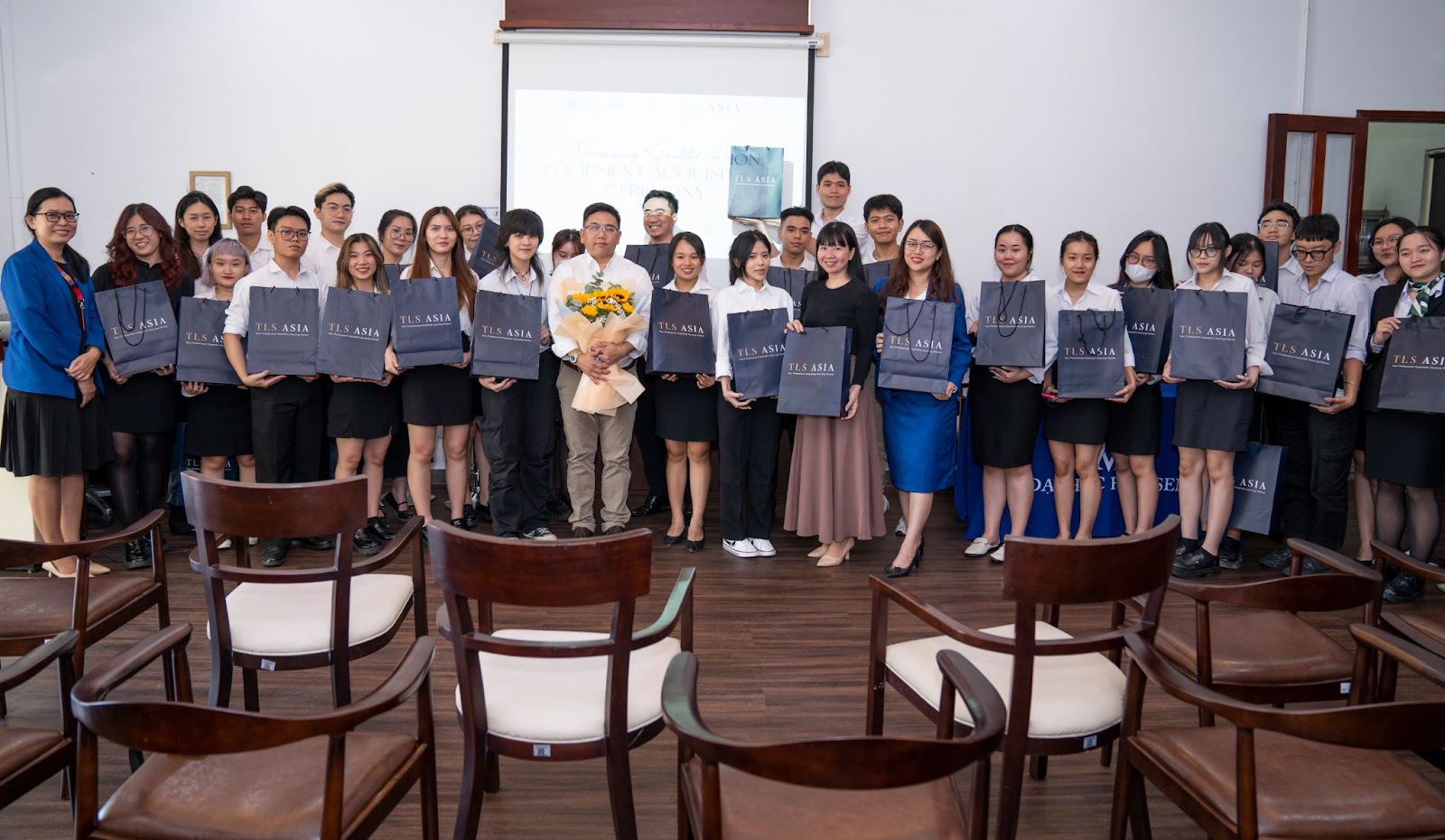 TLS Asia, the Faculty of Hospitality, and participants at the ceremony